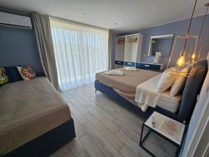 Postel nebo postele na pokoji v ubytování Stella-Guesthouse
