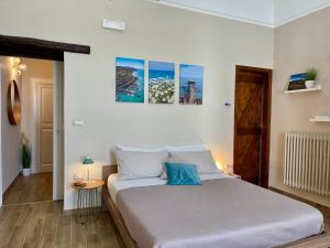 Кровать или кровати в номере B&B La Finestra Sui Tetti