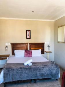 Postel nebo postele na pokoji v ubytování Bergsig Casa Guest House