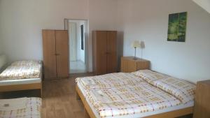 Una cama o camas en una habitación de Hotýlek.eu