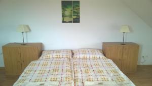 Una cama o camas en una habitación de Hotýlek.eu
