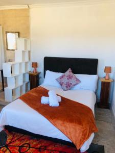 Postel nebo postele na pokoji v ubytování Bergsig Casa Guest House