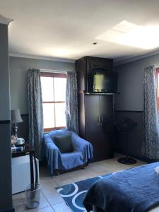 TV a/nebo společenská místnost v ubytování Bergsig Casa Guest House