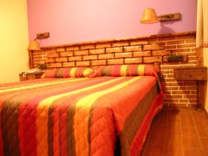 Postel nebo postele na pokoji v ubytování Hostal Xaloa Orio