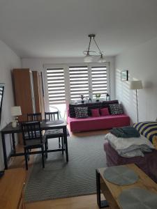 En eller flere senge i et værelse på mieszkanko Kołobrzeg