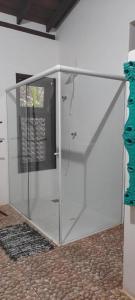 a large glass door in a room at House da Lui in Ubatuba +49 photos