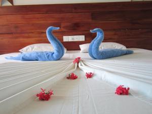 Voodi või voodid majutusasutuse Janus Paradise Rest toas