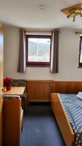 Ένα ή περισσότερα κρεβάτια σε δωμάτιο στο Sportzentrum Gaalerhof