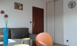 a living room with a couch and a table at Apartment Olomouc in Olomouc