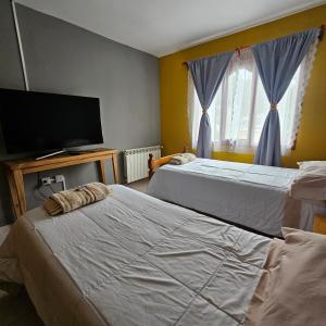 Voodi või voodid majutusasutuse Casa de familia toas