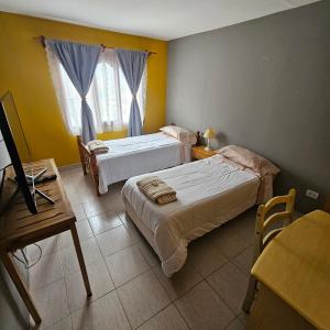 Voodi või voodid majutusasutuse Casa de familia toas