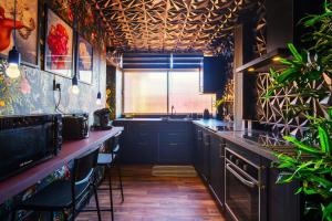 a kitchen with a sink and a counter with plants at Apartamento 951 in Granada