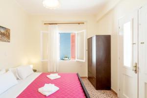 Postel nebo postele na pokoji v ubytování Aloe Apartments