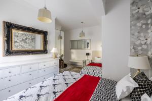 a bedroom with two beds and a mirror at Villa Berfami - Managed by Excelsior Villas in Podstrana