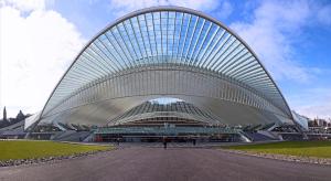 a large white building with a curved roof at LifeinLiege in Liège