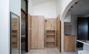 a bathroom with wooden cabinets and a sink at apartmani Nik in Bibinje +41 photos