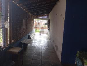 an empty hallway with a bench and a window at Solar dos Rabelo in Belém +7 photos