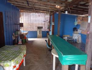 a room with a table and a green table at Solar dos Rabelo in Belém