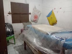a room with a table and an umbrella on the wall at Solar dos Rabelo in Belém