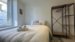 Giường trong phòng chung tại Le Petit Loire +7 ảnh