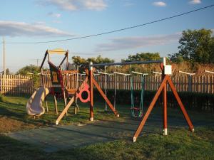 a playground with two swings and a swing at Rumika Ecocenter in Elkhovo