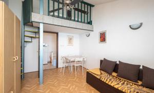 a living room with a couch and a dining room at apartmani Nik in Bibinje