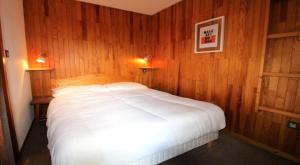 Giường trong phòng chung tại Résidence Le Centre - 2 Pièces pour 6 Personnes MAE-3305