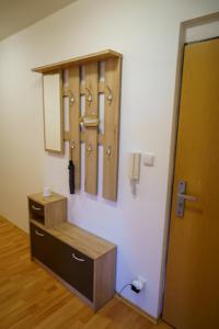 a room with a cabinet and a mirror on a wall at Spacious apartment with a fireplace in the city in Bratislava +154 photos