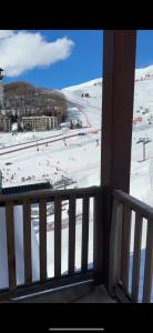 a balcony with a view of a snow covered field at Appartement Orcières-Merlette Pied des Pistes Piscine By Kelly in Orcières