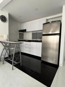 Kuchyň nebo kuchyňský kout v ubytování Apartamento de descanso Peñalisa Ricaurte