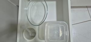 a white toilet with a plastic lid in a bathroom at FLAT-Espaço, conforto.-103 in Anápolis