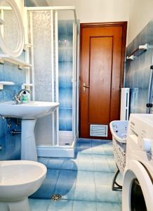 a bathroom with a sink and a toilet and a shower at Spacious studio apartment 45m2 in Palombaro +22 photos