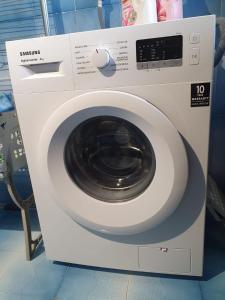a white washing machine in a store at Spacious studio apartment 45m2 in Palombaro