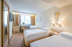 Voodi või voodid majutusasutuse Hotel Scherer toas