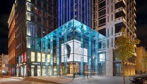 a building with a glass facade on a city street at Classy Studio in Chicago, a Luxurious Condo in Kyiv