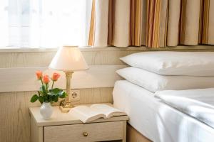 Voodi või voodid majutusasutuse Hotel Scherer toas