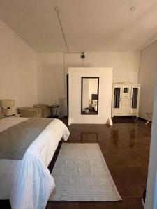 Giường trong phòng chung tại Suite Copal