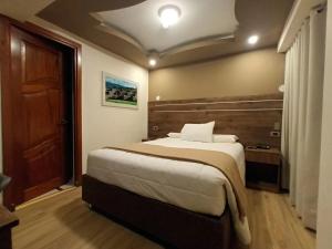 Voodi või voodid majutusasutuse INKALAM cusco toas