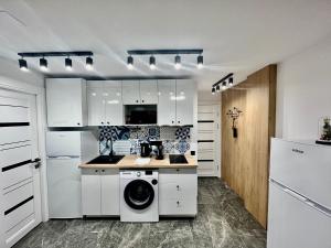 Kuchyň nebo kuchyňský kout v ubytování Elegante Apartamento TRES COLORES