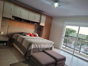 En eller flere senge i et værelse på Casa próxima ao Centro