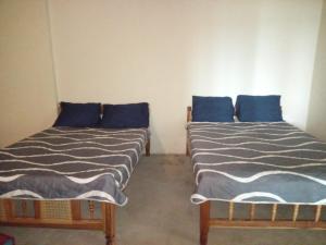 Ένα ή περισσότερα κρεβάτια σε δωμάτιο στο Casita d Playa 2