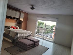 En eller flere senge i et værelse på Casa próxima ao Centro