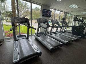 a row of tread machines in a gym at Condominium Sunny Isles Ocean Reserve in Sunny Isles Beach