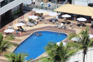 an overhead view of a swimming pool in a hotel at Ondina Apart Hotel Cobetura in Salvador