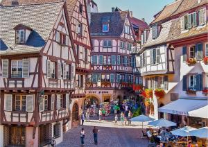 a group of buildings and people walking in a street at Mulhouse City Loft in Mulhouse