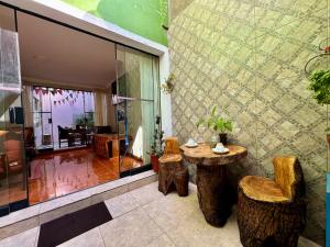a room with a table and two stools and a room with a room at Tika house in Cusco +41 photos