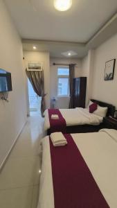 Letto o letti in una camera di Conico Đà Lạt Hotel