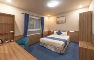 Postel nebo postele na pokoji v ubytování Rum Vang Hotel Da Lat