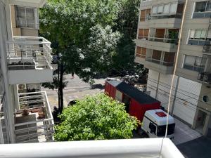 an overhead view of a street with a fire truck and buildings at Monoambiente lujoso en Cañitas! in Buenos Aires