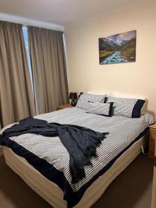 Letto o letti in una camera di Methven Mountain View Apartment